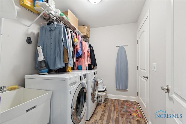 10 Hidden Village Ln, Holland, OH 43528 - laundry area featuring washing machine and dryer and wood finished floors