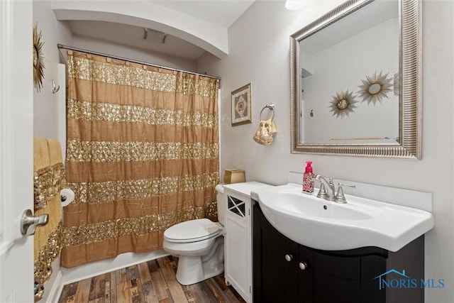 10 Hidden Village Ln, Holland, OH 43528 - full bath with vanity, wood finished floors, and shower / bath combo with shower curtain