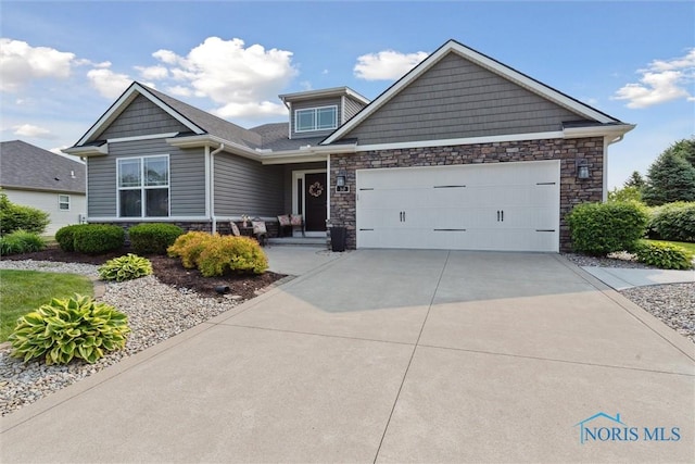 10 Hidden Village Ln, Holland, OH 43528 - craftsman-style house featuring stone siding, concrete driveway, and a garage