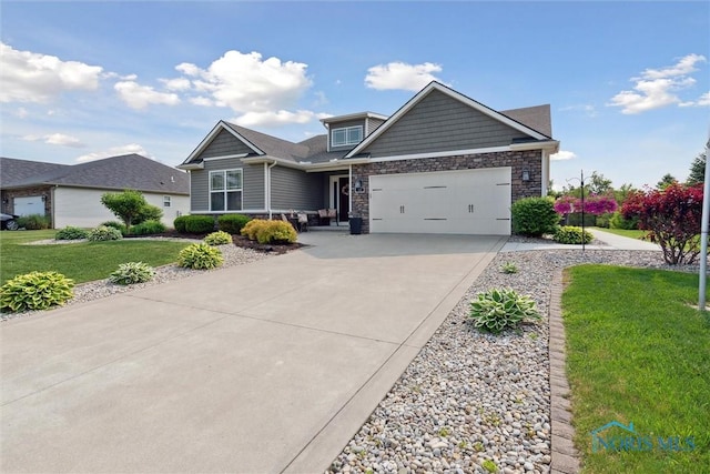 10 Hidden Village Ln, Holland, OH 43528 - craftsman-style house with concrete driveway, a garage, a front lawn, and stone siding