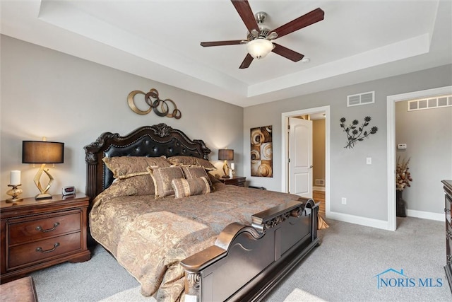 10 Hidden Village Ln, Holland, OH 43528 - bedroom with a raised ceiling, carpet, and ceiling fan