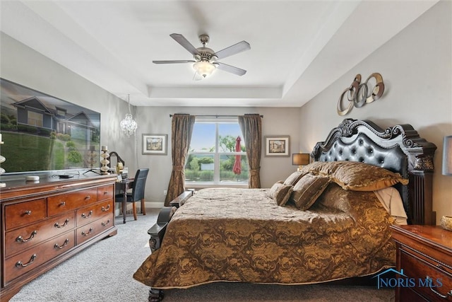 10 Hidden Village Ln, Holland, OH 43528 - carpeted bedroom featuring a raised ceiling and a ceiling fan