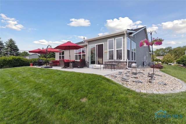 10 Hidden Village Ln, Holland, OH 43528 - rear view of property featuring an outdoor hangout area, a patio, a lawn, and stone siding