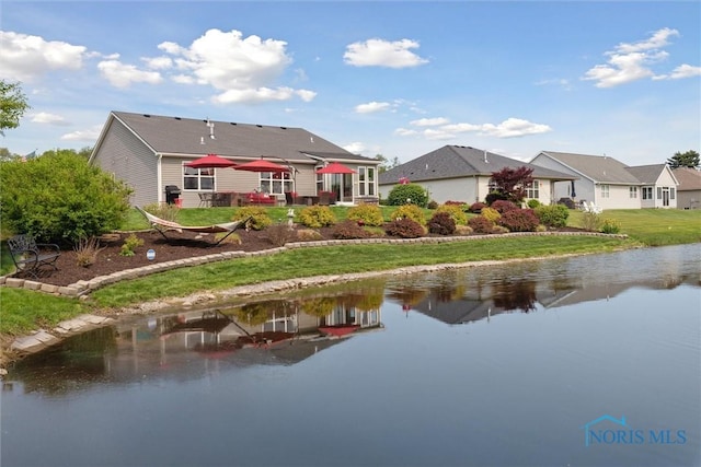 10 Hidden Village Ln, Holland, OH 43528 - rear view of house featuring a water view, a yard, and a residential view
