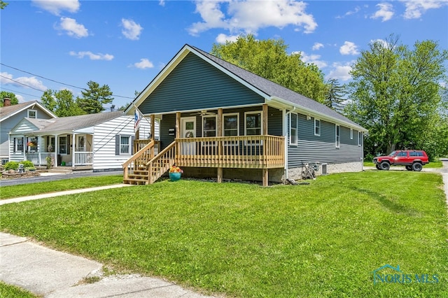 1313 Washington Ave, Findlay, OH 45840 - view of front of house featuring a porch and a front yard