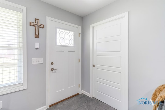 1313 Washington Ave, Findlay, OH 45840 - entryway with dark tile patterned flooring and baseboards