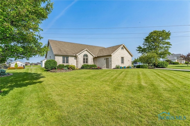 3112 Jacob Dr, Findlay, OH 45840 - view of front of property featuring a front yard and brick siding