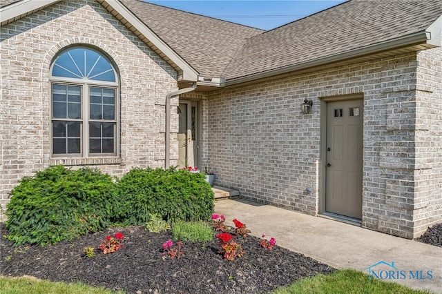 3112 Jacob Dr, Findlay, OH 45840 - property entrance with brick siding and a shingled roof