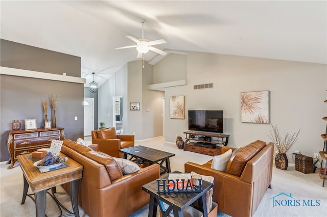 3112 Jacob Dr, Findlay, OH 45840 - living area with light colored carpet, high vaulted ceiling, and ceiling fan