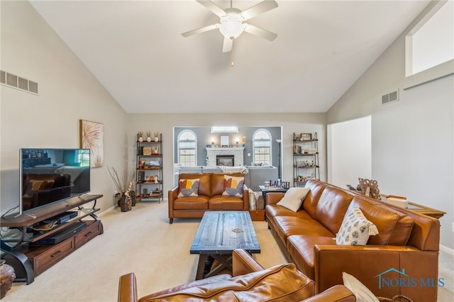 3112 Jacob Dr, Findlay, OH 45840 - living area with carpet floors, high vaulted ceiling, ceiling fan, a glass covered fireplace, and baseboards