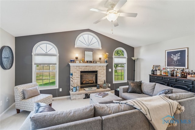 3112 Jacob Dr, Findlay, OH 45840 - living area with vaulted ceiling, a ceiling fan, carpet flooring, baseboards, and a brick fireplace