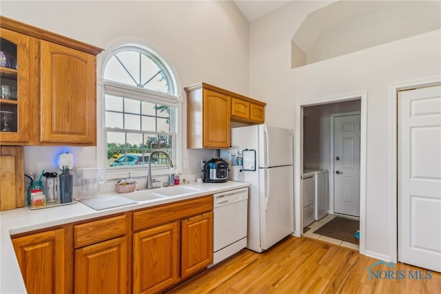 3112 Jacob Dr, Findlay, OH 45840 - kitchen with white appliances, a sink, glass insert cabinets, a high ceiling, and washing machine and clothes dryer
