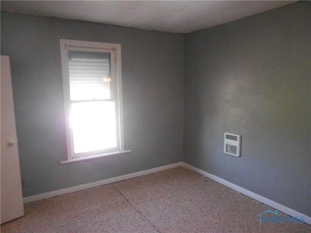 2815 Mulberry St, Toledo, OH 43608 - carpeted empty room featuring baseboards and heating unit