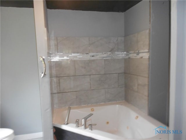 2815 Mulberry St, Toledo, OH 43608 - bathroom featuring toilet and a combined bath / shower with jetted tub