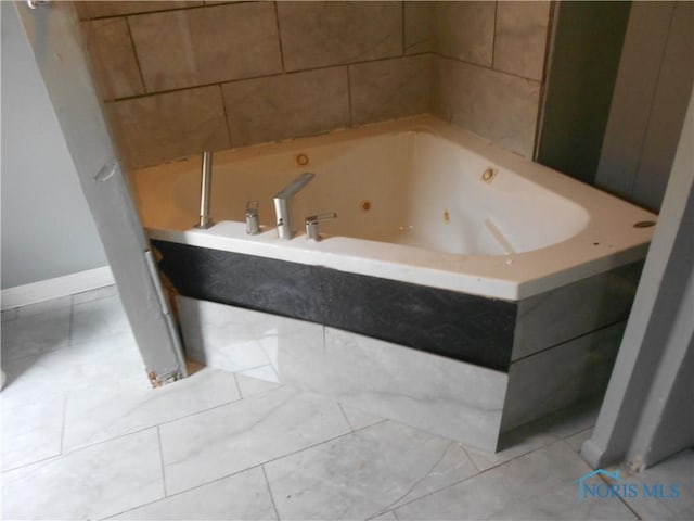2815 Mulberry St, Toledo, OH 43608 - bathroom with a whirlpool tub, baseboards, and tile patterned flooring