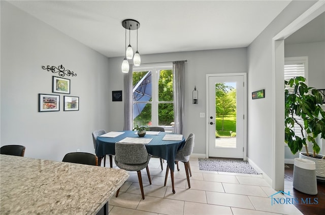 16187 Sugar Maple Ct, Findlay, OH 45840 - dining room featuring light tile patterned flooring and baseboards