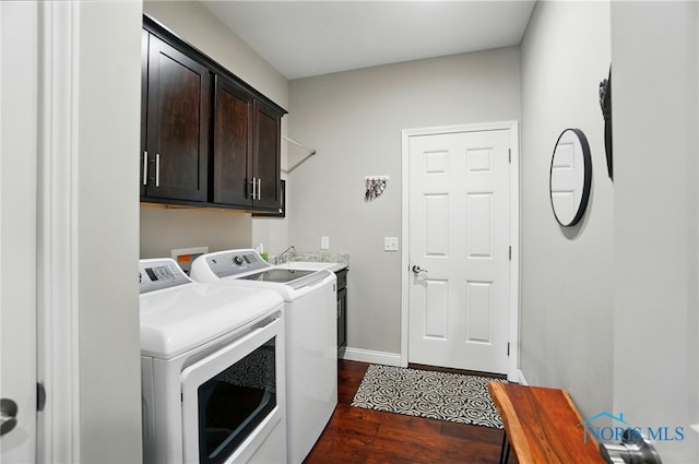 16187 Sugar Maple Ct, Findlay, OH 45840 - laundry area with cabinet space, washing machine and dryer, dark wood finished floors, and baseboards