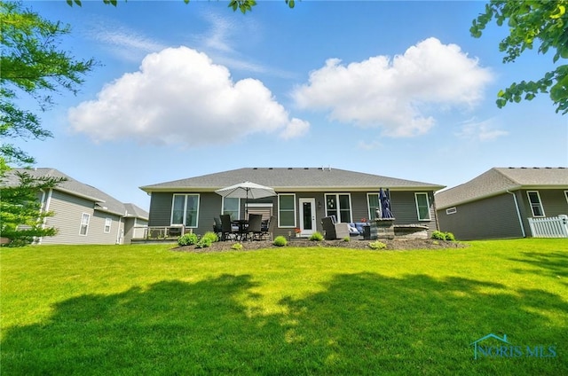 16187 Sugar Maple Ct, Findlay, OH 45840 - rear view of property featuring a lawn and a patio area