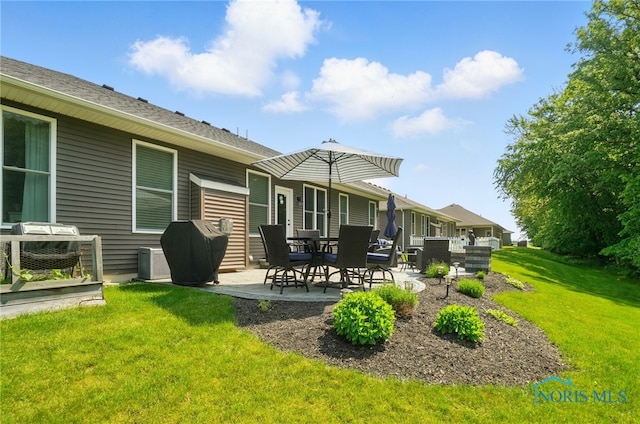 16187 Sugar Maple Ct, Findlay, OH 45840 - back of property with a patio and a lawn