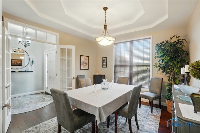 16187 Sugar Maple Ct, Findlay, OH 45840 - dining area with a tray ceiling, dark wood-type flooring, baseboards, and french doors