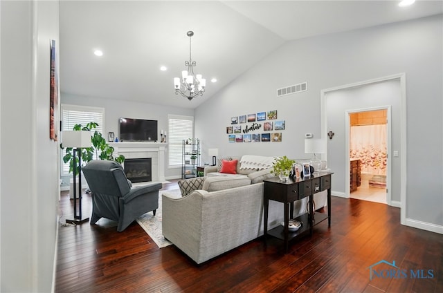 16187 Sugar Maple Ct, Findlay, OH 45840 - living area featuring dark wood-type flooring, a chandelier, a fireplace, recessed lighting, and baseboards
