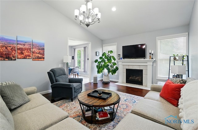 16187 Sugar Maple Ct, Findlay, OH 45840 - living room with a chandelier, wood finished floors, a fireplace, baseboards, and vaulted ceiling