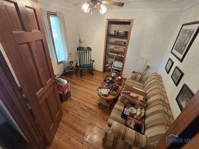 2111 Cobblestone Dr, Findlay, OH 45840 - living area with wood finished floors, ornamental molding, and a ceiling fan