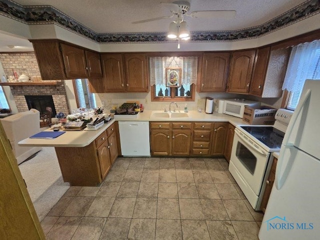 2111 Cobblestone Dr, Findlay, OH 45840 - kitchen featuring white appliances, a sink, plenty of natural light, ceiling fan, and a textured ceiling