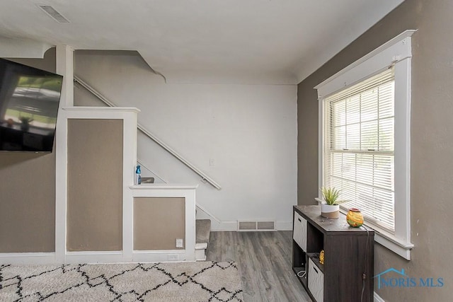 1129 Mason St, Toledo, OH 43605 - foyer entrance with wood finished floors, baseboards, and stairs