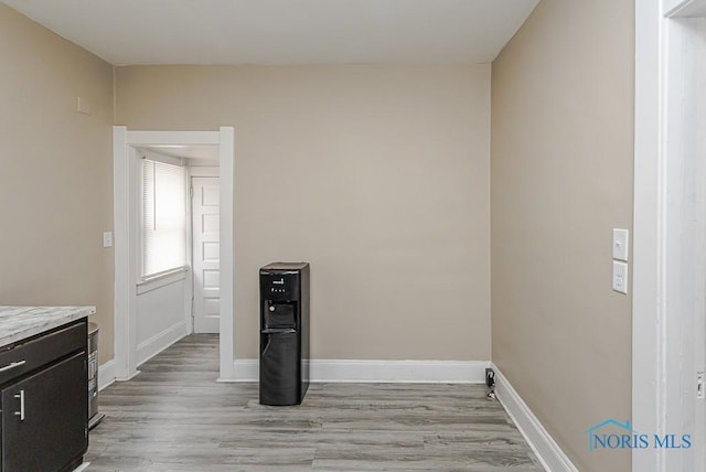 1129 Mason St, Toledo, OH 43605 - laundry room with light wood-style flooring and baseboards