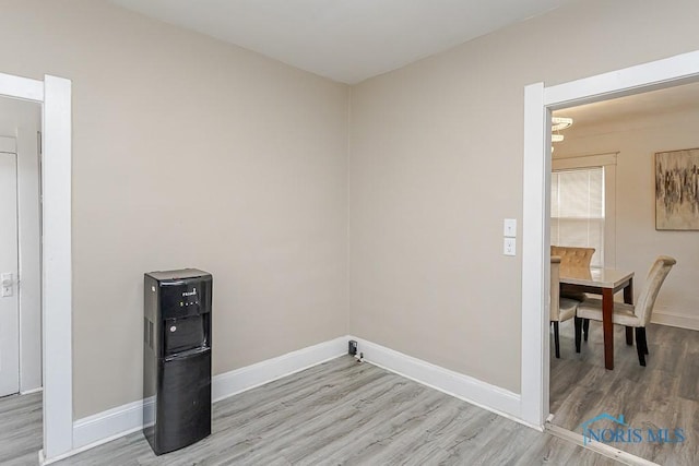 1129 Mason St, Toledo, OH 43605 - laundry area with light wood-style flooring and baseboards