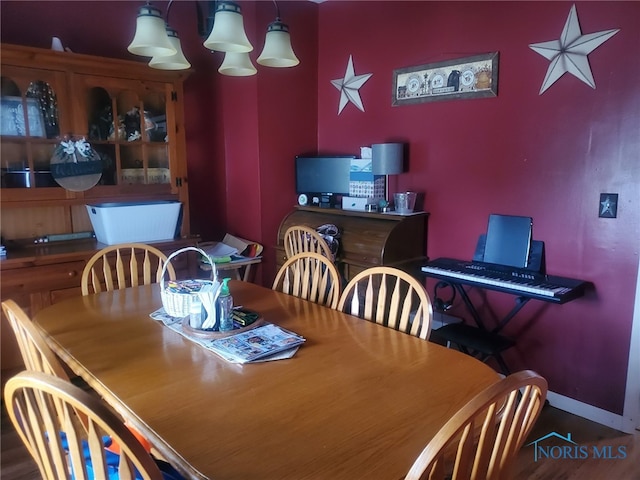 406 S State St, Pioneer, OH 43554 - dining room featuring baseboards