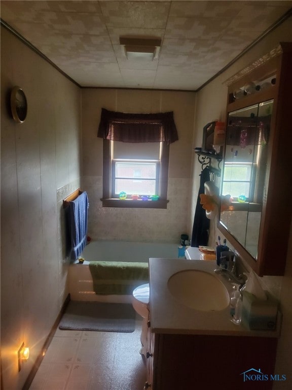 406 S State St, Pioneer, OH 43554 - bathroom with a bathtub, vanity, tile patterned floors, and toilet