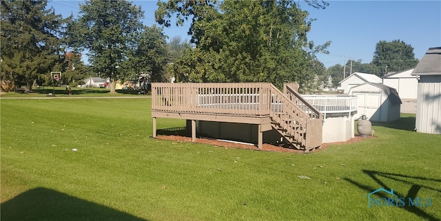 406 S State St, Pioneer, OH 43554 - view of grassy yard featuring a deck