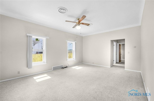 2101 Trailview Dr, Maumee, OH 43537 - spare room featuring carpet, a ceiling fan, and baseboards