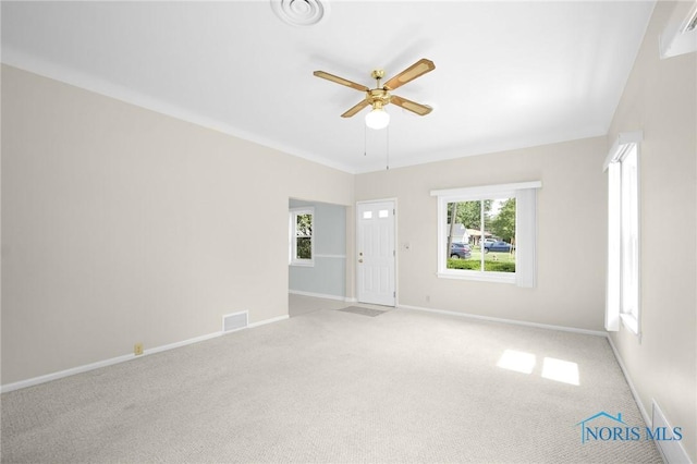 2101 Trailview Dr, Maumee, OH 43537 - empty room with a ceiling fan, baseboards, and carpet floors