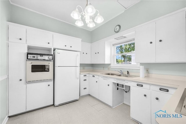 2101 Trailview Dr, Maumee, OH 43537 - kitchen featuring white appliances, a sink, light countertops, and white cabinetry