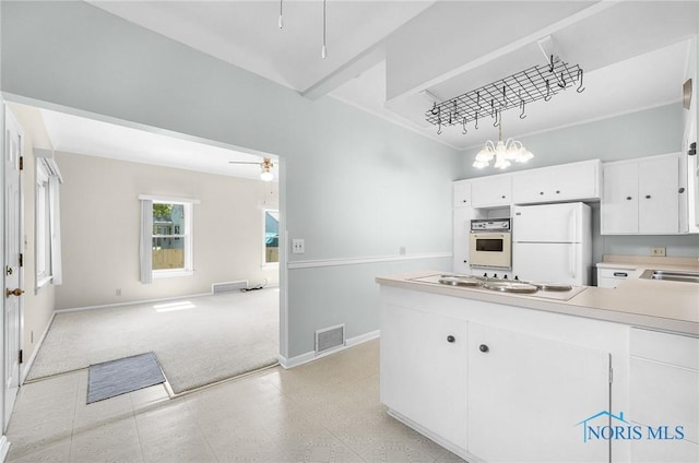 2101 Trailview Dr, Maumee, OH 43537 - kitchen featuring white appliances, open floor plan, baseboards, and white cabinetry
