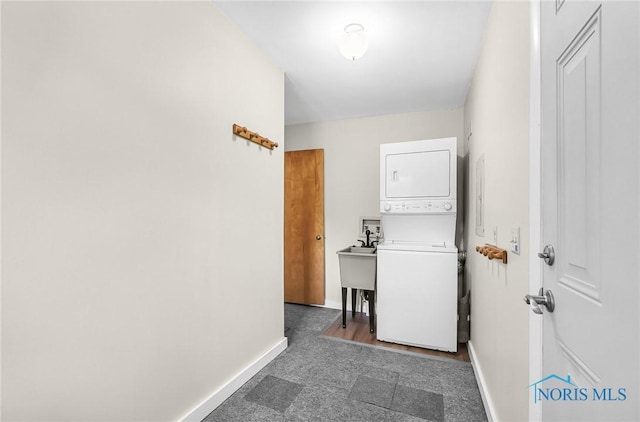 2101 Trailview Dr, Maumee, OH 43537 - washroom with estacked washer and dryer and baseboards