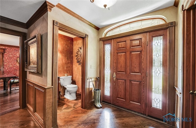 25840 W River Rd, Perrysburg, OH 43551 - foyer entrance featuring dark wood-type flooring and ornamental molding