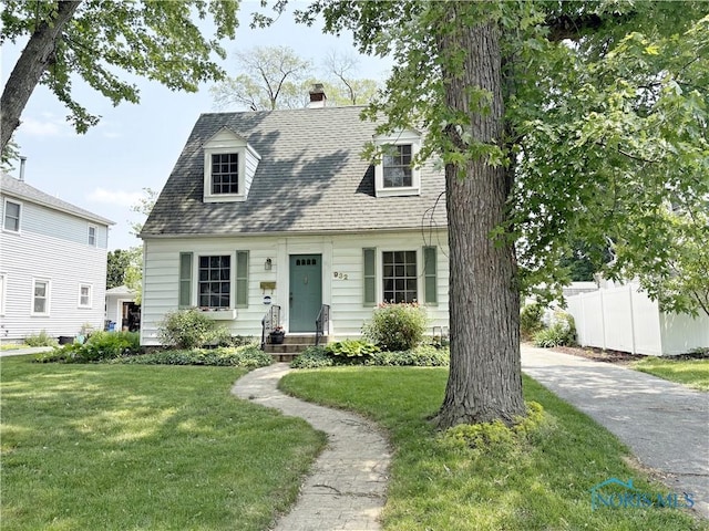 932 N Grove St, Bowling Green, OH 43402 - cape cod home featuring a chimney and a shingled roof