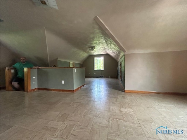 3030 Colby Dr, Toledo, OH 43614 - additional living space with lofted ceiling and baseboards