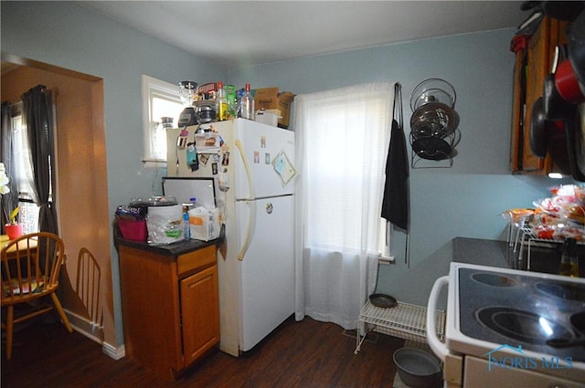 2617 York St, Toledo, OH 43605 - kitchen featuring white appliances, plenty of natural light, and dark wood finished floors