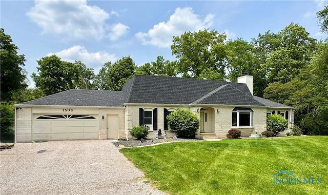 1508 Darbyshire Dr, Defiance, OH 43512 - view of front facade with a garage, driveway, a front lawn, a chimney, and a shingled roof