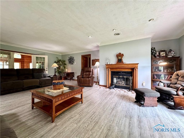 1508 Darbyshire Dr, Defiance, OH 43512 - living area with a textured ceiling, wood finished floors, a fireplace with flush hearth, and crown molding