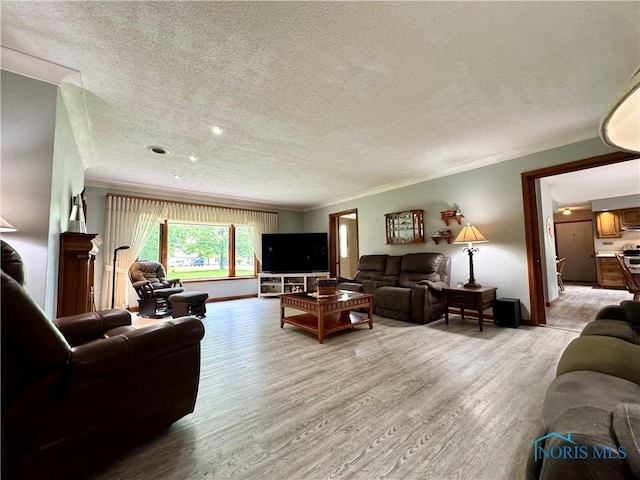 1508 Darbyshire Dr, Defiance, OH 43512 - living area with a textured ceiling, wood finished floors, baseboards, and crown molding