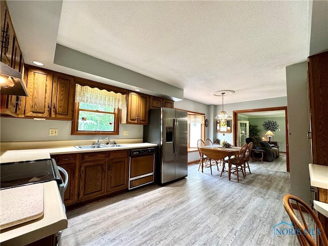 1508 Darbyshire Dr, Defiance, OH 43512 - kitchen with stainless steel refrigerator with ice dispenser, dishwasher, a textured ceiling, a sink, and light wood-style flooring