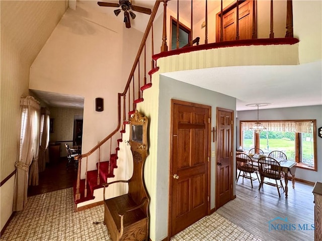 1508 Darbyshire Dr, Defiance, OH 43512 - foyer with stairway, a towering ceiling, wood finished floors, ceiling fan, and baseboards
