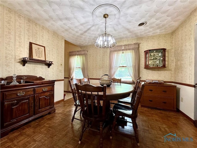 1508 Darbyshire Dr, Defiance, OH 43512 - dining room featuring wallpapered walls, a chandelier, and baseboards