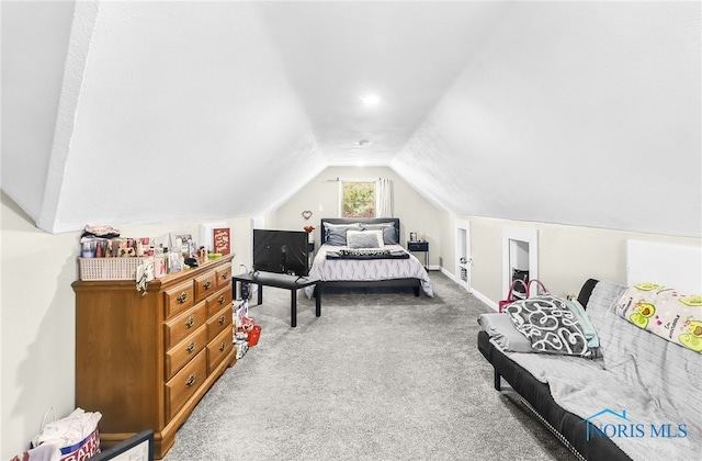224 Elm St, Rossford, OH 43460 - carpeted bedroom featuring vaulted ceiling and baseboards